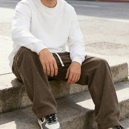 Férfi, laza fazonú, zsebes, húzózsinórral ellátott nadrág